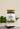 A glass jar containing loose tea leaves and herbs, with a label that reads 'MeganCo. Fit as a Fiddle TEA BLEND.
