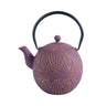 Purple teapot with gold geometric patterns on a white background