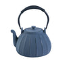 Blue ceramic teapot with a ribbed design on a white background