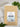 MEGAN & CO. Boji Bliss tea in kraft bag, displayed against white marble and green plants. 