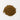 A small mound of reddish-brown, woody cassia cinnamon chips centered on a plain white surface.