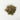 A small, textured mound of dried green cleavers leaves and thin, chopped stems centered on a clean white surface.