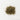 A small, textured mound of dried, sage-green damiana leaves and finely chopped stems centered on a clean white surface.