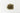 A small, textured mound of dried, sage-green damiana leaves and finely chopped stems centered on a clean white surface.