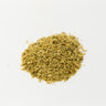 A small, delicate mound of tiny, dried creamy-yellow elder flowers, showing fine floral textures, centered on a clean white surface.
