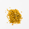A small mound of dried orange peel, consisting of bright golden-orange, irregularly shaped citrus fragments, staged on a clean white background.
