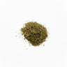 A small, centered mound of dried thyme leaves, consisting of fine, needle-like herbal fragments in a muted olive-green color, staged on a clean white background.