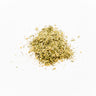 A small mound of dried yarrow leaves and flower heads, featuring a fine, feathery texture with pale green and yellowish-tan herbal fragments, placed on a clean white background.