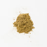 A small, mounded pile of finely ground kava kava root powder, featuring a uniform earthy tan color and a soft, flour-like texture on a clean white surface.