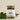 A glass jar containing loose tea leaves and herbs, with a label that reads 'MeganCo. Fit as a Fiddle TEA BLEND.