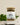 A glass jar containing loose tea leaves and herbs, with a label that reads 'MeganCo. Fit as a Fiddle TEA BLEND.