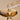 Glass dropper releasing golden herbal oil with smooth reflective texture.