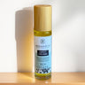 Roll-on bottle of Megan & Co Sweet Dreams on a wooden surface with a white background