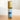 Megan & Co Ginger Rose roll-on bottle on a wooden surface with a white background