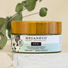 Megan & Co. Ease Herbal Whip jar with a bamboo lid on a white marble surface with eucalyptus leaves in the background.