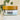 Megan & Co. Heel + Knuckle herbal salve jar with a bamboo lid on a white marble surface with eucalyptus leaves in the background.