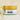 Megan & Co. Sweet Tush herbal salve jar with bamboo lid on white marble with baby's breath flowers on its side.