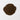 A rounded mound of dark, rich brown roasted chicory root granules centered on a stark white background.