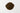 A rounded mound of dark, rich brown roasted chicory root granules centered on a stark white background.