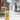 Clear glass bottle with a brown lid on a sidewalk with blurred background