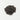 A small, rounded mound of tiny, dark purple-to-black dried elderberries centered on a clean white surface.