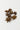A 28g scattering of whole brown star anise pods on a clean, solid white surface.