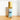 Roll-on bottle labeled 'Woods' by Megan & Co. on a wooden surface with a white background